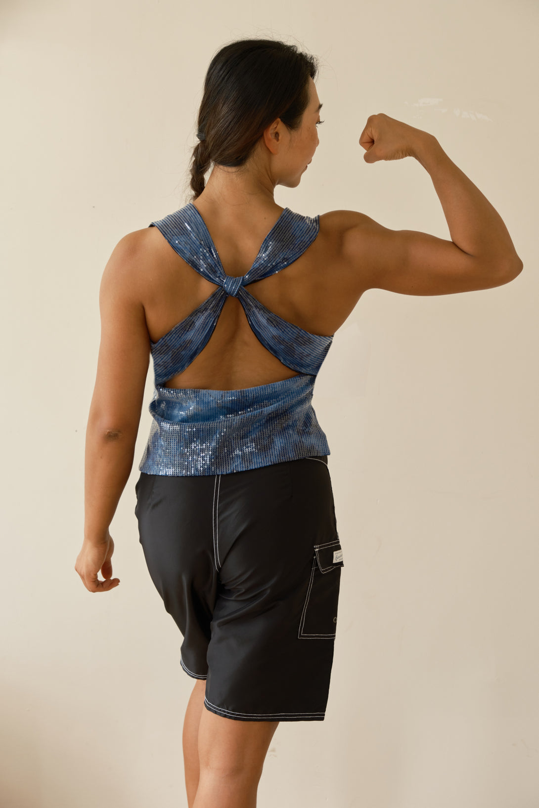 Athletic woman in sleek Amber top